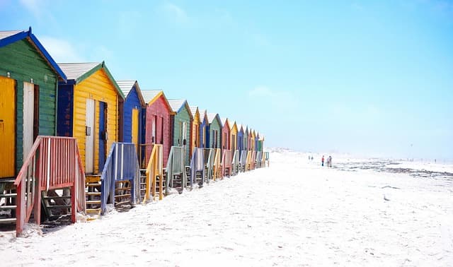 beach, beach huts, colorful, facade, houses, huts, outdoors, sand, sea, seashore, seaside, staircase, vacation, white sand, sandy beach, shore, nature, sandy