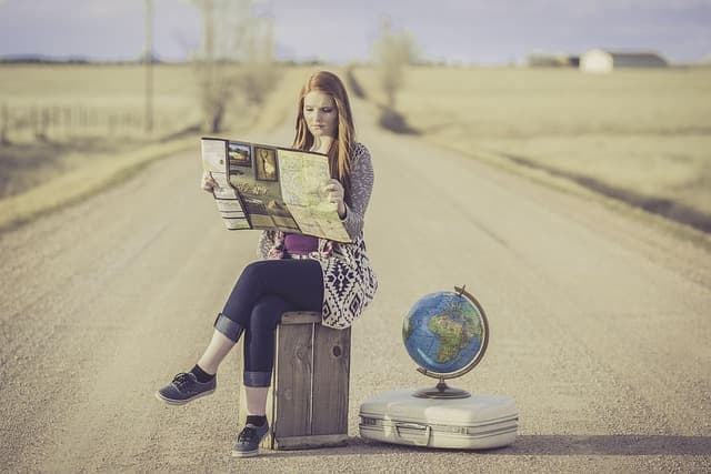 globe trotter, traveller, globe, map, journey, planning, waiting, female, woman, world, road, dirt road, travel, traveling, world map, outdoors, young woman